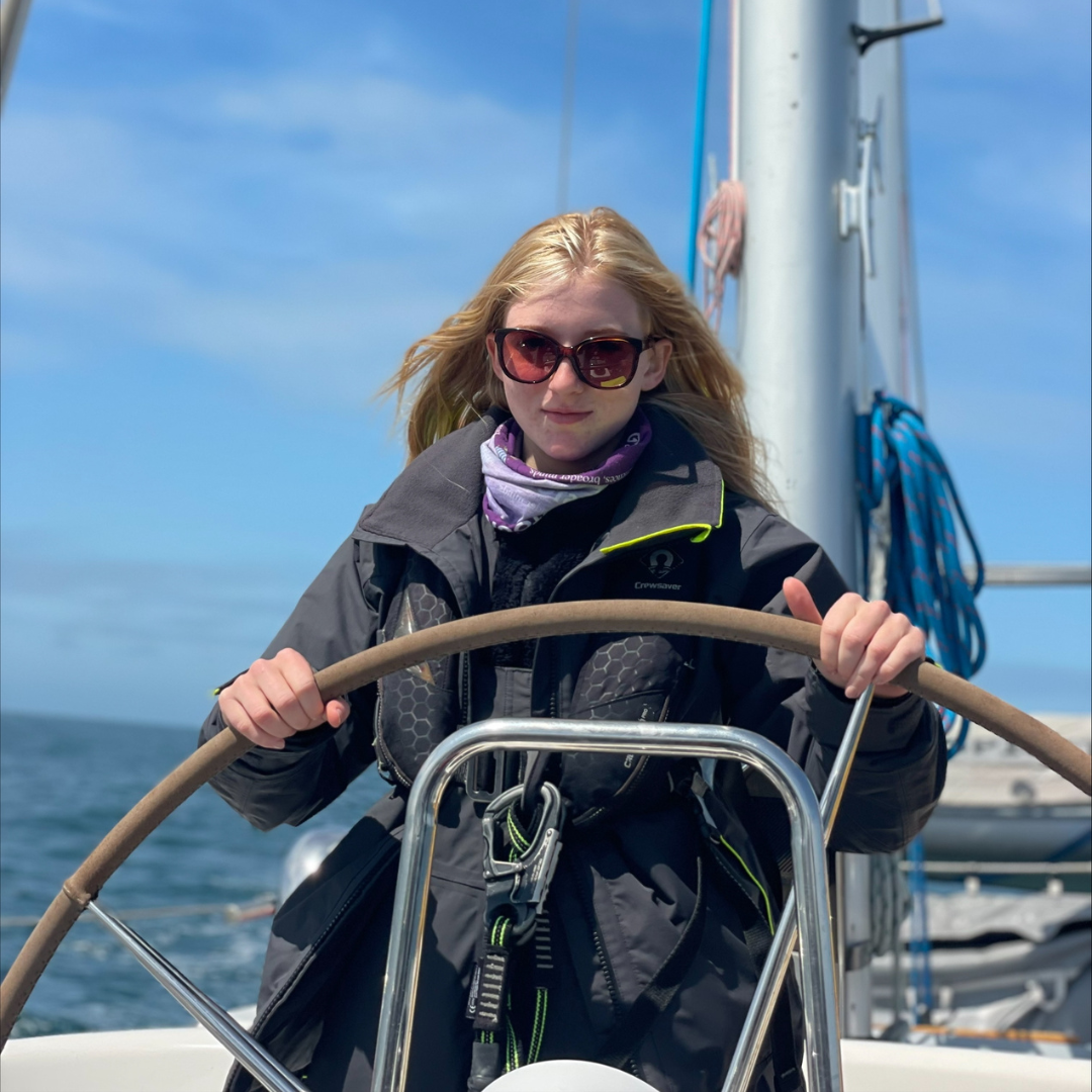 Gordonstoun student steering aboard Ocean Spirit of Moray